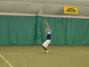 Boy Serving on Indoor Courts